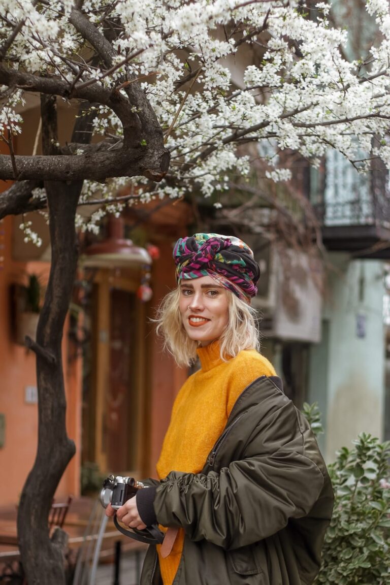 a young woman in a bright outfit and a turban on t 2023 11 27 05 28 43 utc